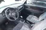 Vue arrière microcar sur aire de stationnement