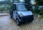 Profil latéral montrant le plateau arrière et la cabine compacte